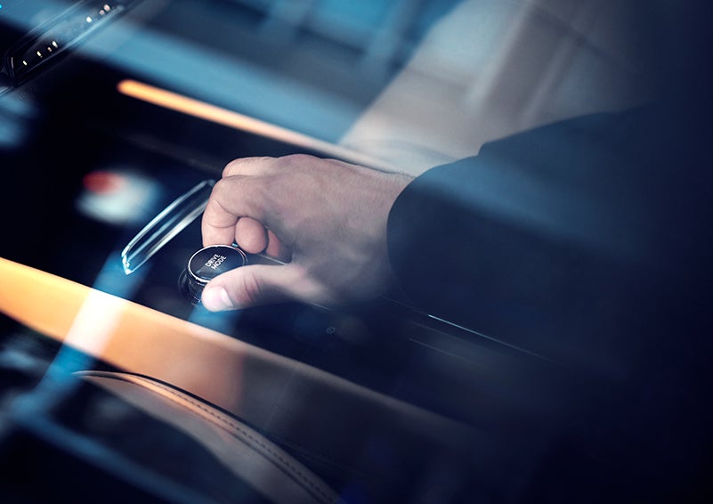 The driver of a 2023 Lincoln Corsair® SUV is shown adjusting the drive mode. | Bill Knight Lincoln in Tulsa OK