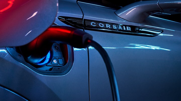 A charger plugged into the charging port of a 2024 Lincoln Corsair® Plug-in Hybrid model. | Bill Knight Lincoln in Tulsa OK