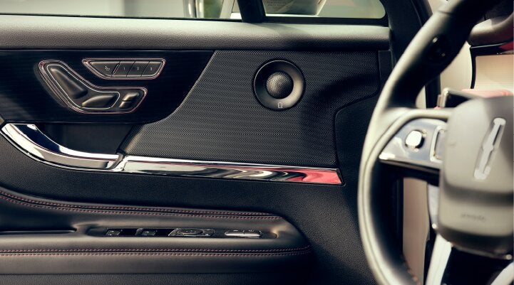 A Revel® audio speaker is shown in the driver's side door of a 2025 Lincoln Corsair® SUV. | Bill Knight Lincoln in Tulsa OK