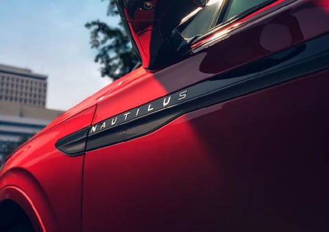 A side badge on the passenger door reads Nautilus. | Bill Knight Lincoln in Tulsa OK