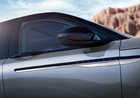 Blue lettering on the side of the vehicle that reads nautilus indicates the available hybrid powertrain. | Bill Knight Lincoln in Tulsa OK