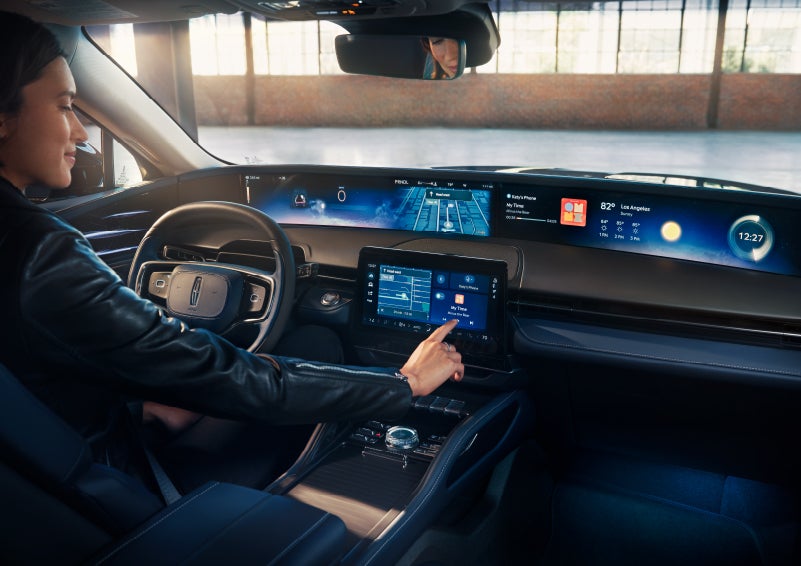 The driver of a 2025 Lincoln Nautilus® SUV interacts with the center touchscreen. | Bill Knight Lincoln in Tulsa OK