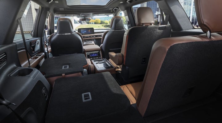 One side of the PowerFold® third-row seat and a second-row seat are folded forward in the 2026 Lincoln Aviator® SUV. | Bill Knight Lincoln in Tulsa OK
