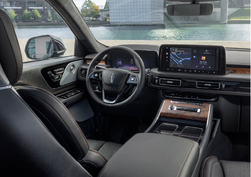 The interior of the 2026 Lincoln Aviator® SUV is shown parked with a view of a harbor through the windshield. | Bill Knight Lincoln in Tulsa OK