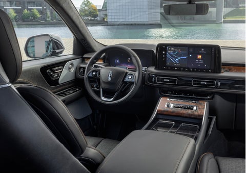 The interior of the 2026 Lincoln Aviator® SUV is shown parked with a view of a harbor through the windshield. | Bill Knight Lincoln in Tulsa OK