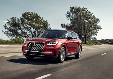 A 2026 Lincoln Corsair® SUV is shown being driven on a country road. | Bill Knight Lincoln in Tulsa OK