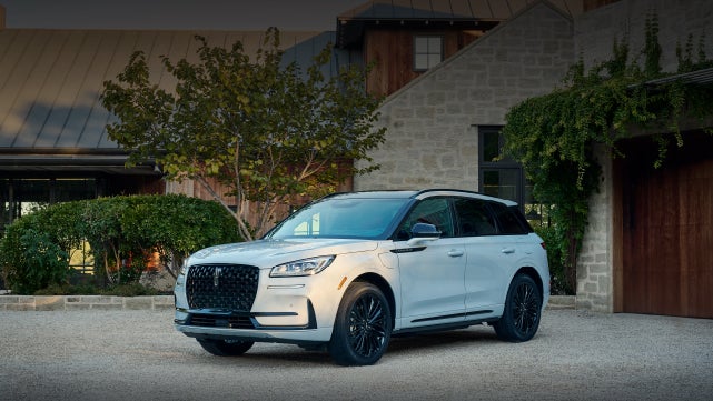 A 2026 Lincoln Corsair® SUV is parked in front off a luxury home. | Bill Knight Lincoln in Tulsa OK