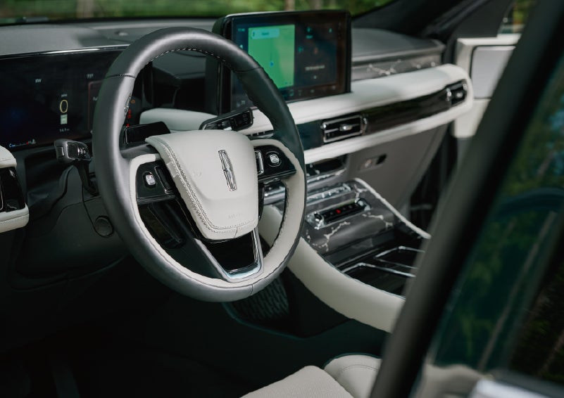 The leather-trimmed steering wheel of a 2027 Lincoln Aviator® Black Label™ SUV. | Bill Knight Lincoln in Tulsa OK