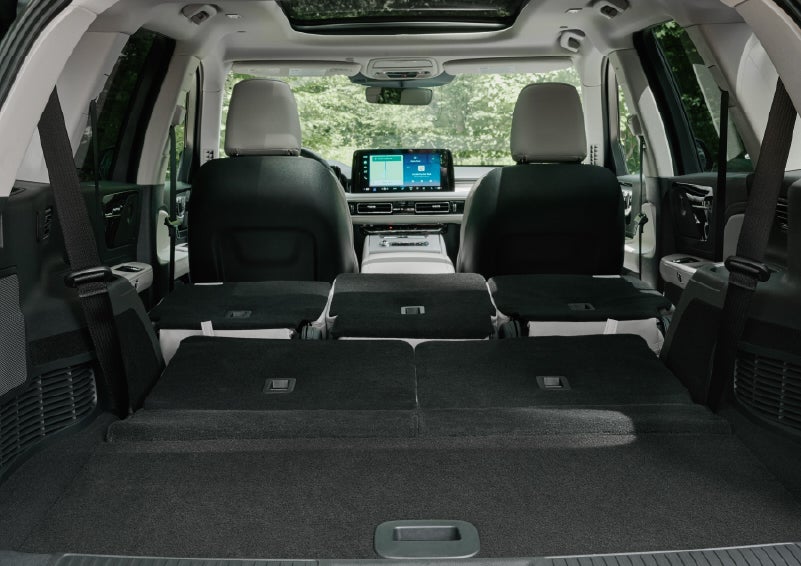 A rear to front view of the interior of a 2027 Lincoln Aviator® Black Label™ SUV shows the third and second rows folded flat | Bill Knight Lincoln in Tulsa OK